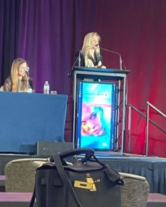 Dr Jennifer Murdock giving a pesentation on Rhinoplasty