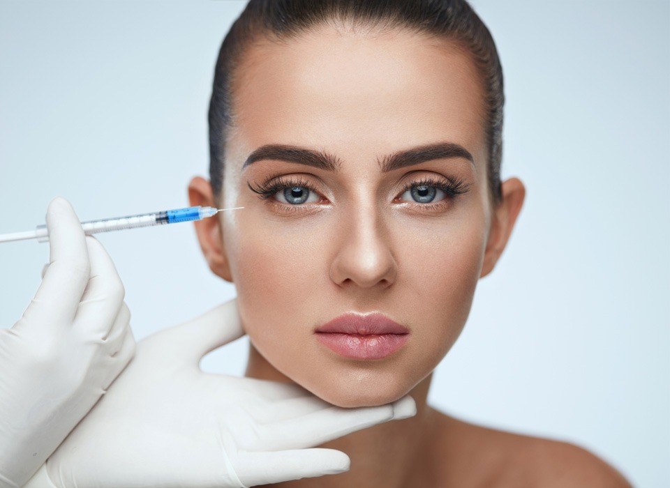 stock image of model having injection to her face